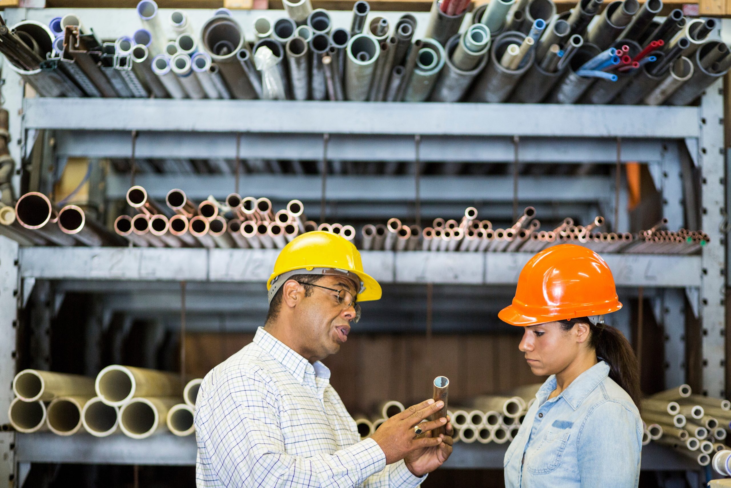 two warehouse workers looking at copper pipe 2025 04 04 15 45 44 utc scaled
